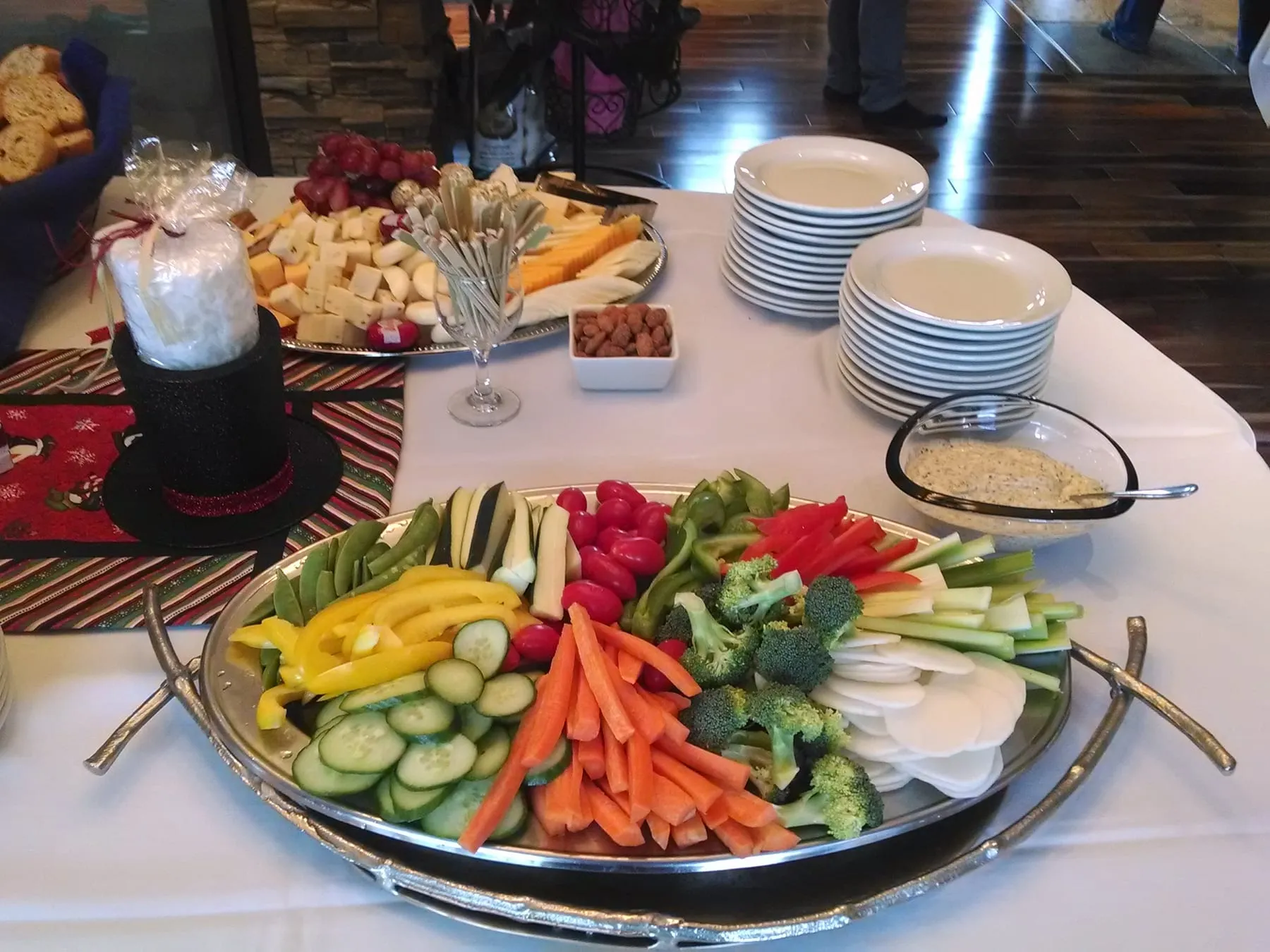Crudite and cheese platters laid out for an office lunch