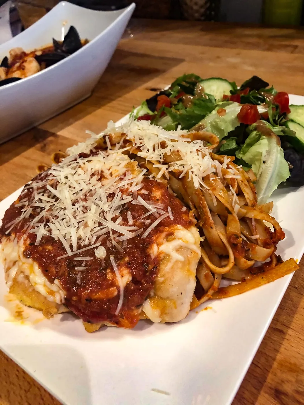 Chicken parmesan, plated for service