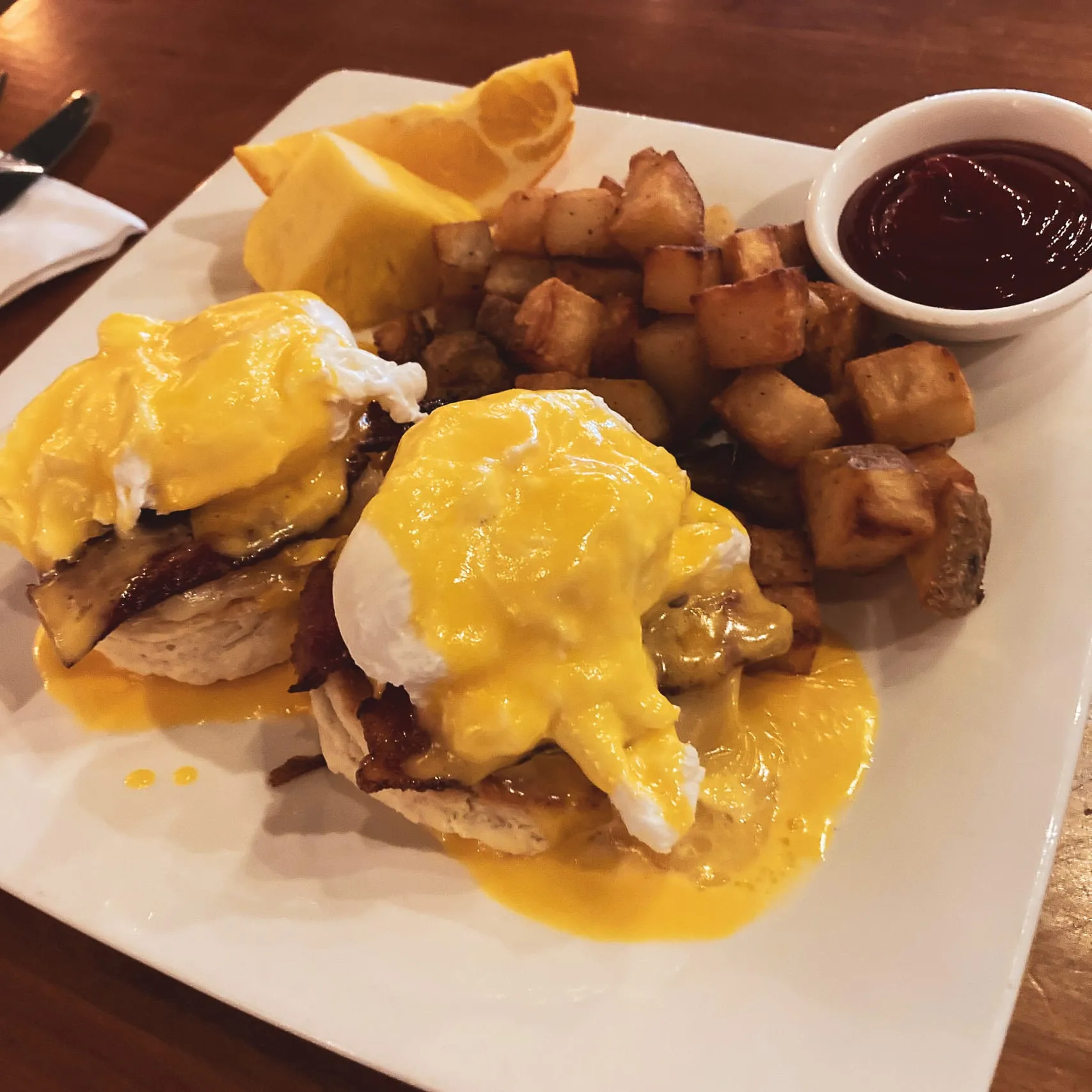 Eggs benedict plated for a brunch service