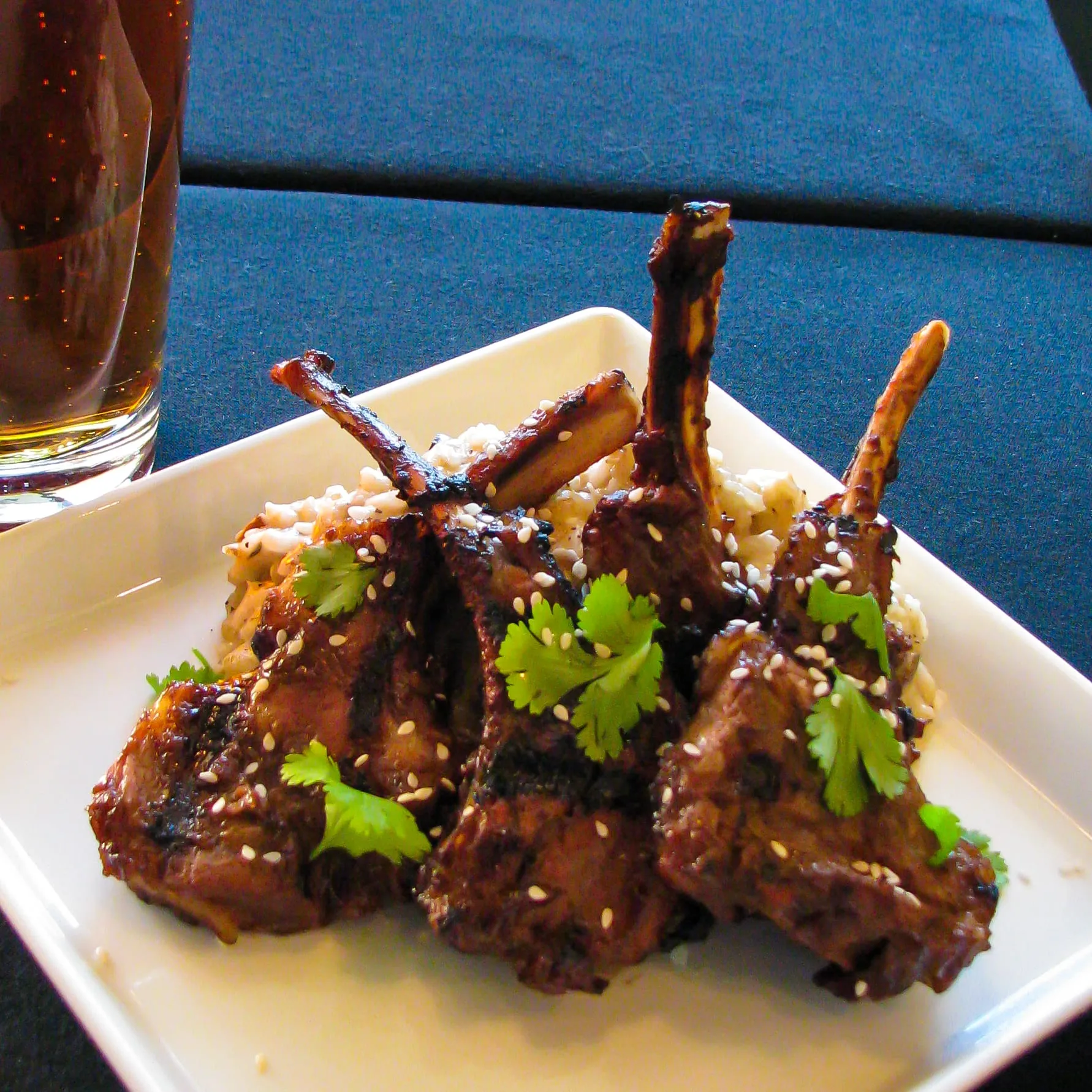 Rack of lamb, carved and plated with jus